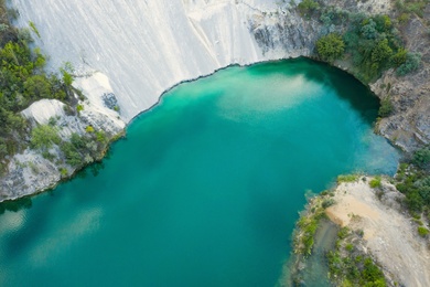 Image of Beautiful turquoise lake with granite banks, aerial view
