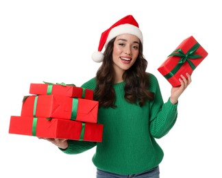 Beautiful young woman in Santa hat with Christmas gifts isolated on white