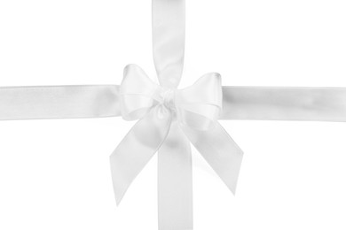 Photo of Satin ribbons with bow on white background, top view