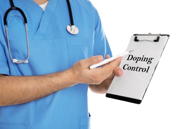 Doctor holding clipboard with text Doping Control on white background, closeup