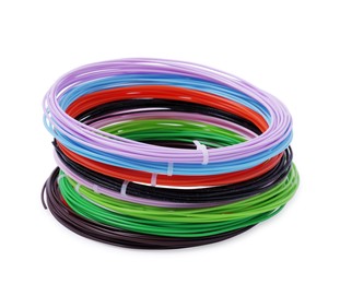 Photo of Stack of colorful plastic filaments for 3D pen on white background