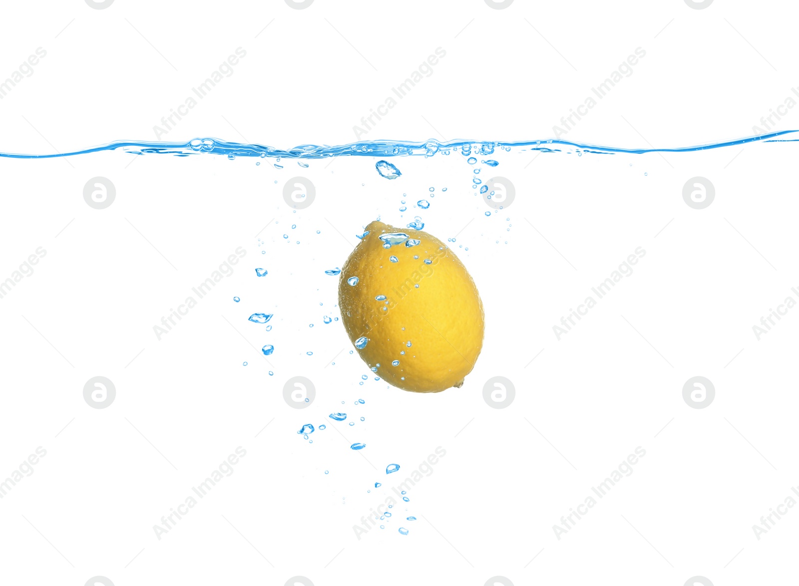 Photo of Ripe lemon falling down into clear water against white background
