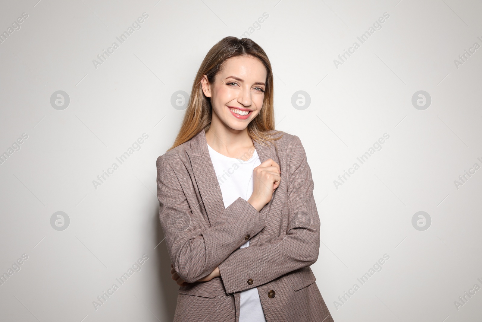 Photo of Portrait of young woman with beautiful face on light background