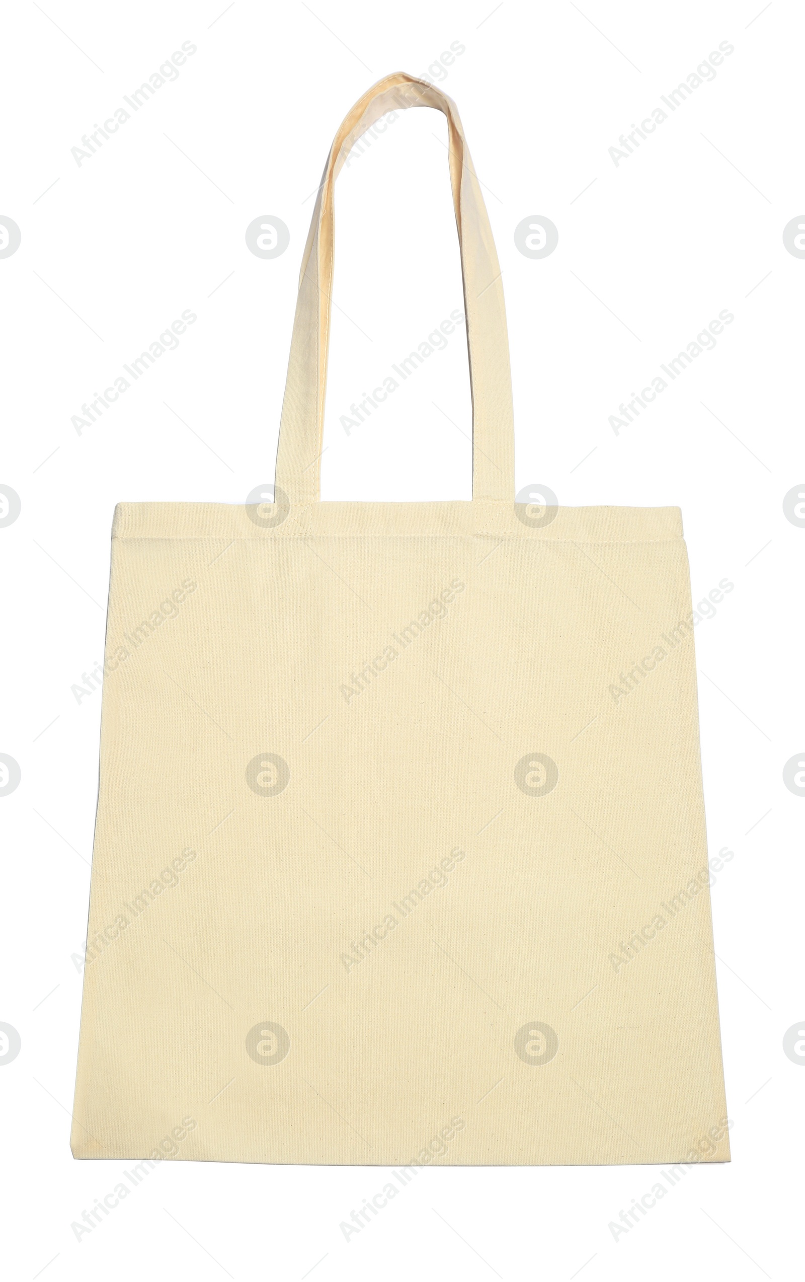 Photo of Blank beige textile bag on white background, top view. Mockup for design