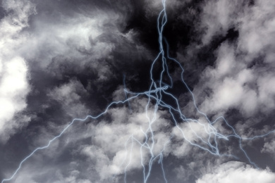 Image of Lightning in sky covered with rainy clouds. Stormy weather