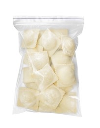 Photo of Plastic bag with uncooked ravioli on white background, top view