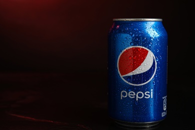 Photo of MYKOLAIV, UKRAINE - FEBRUARY 08, 2021: Can of Pepsi with water drops on color background. Space for text