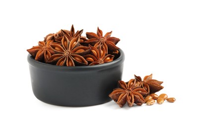 Photo of Bowl and dry anise stars on white background