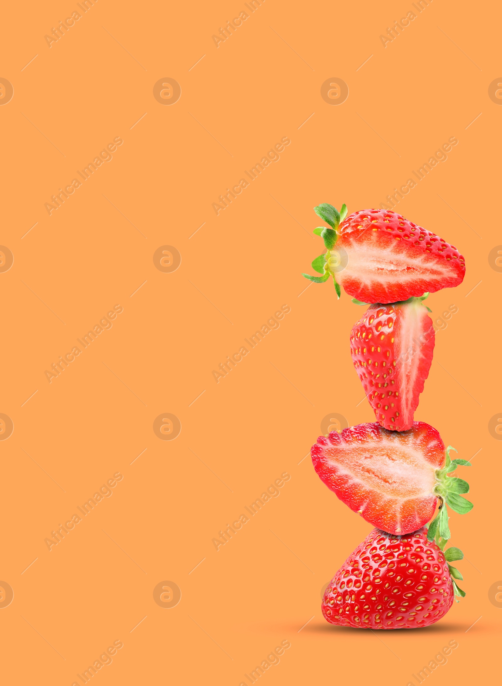 Image of Stack of fresh strawberries on orange background, space for text