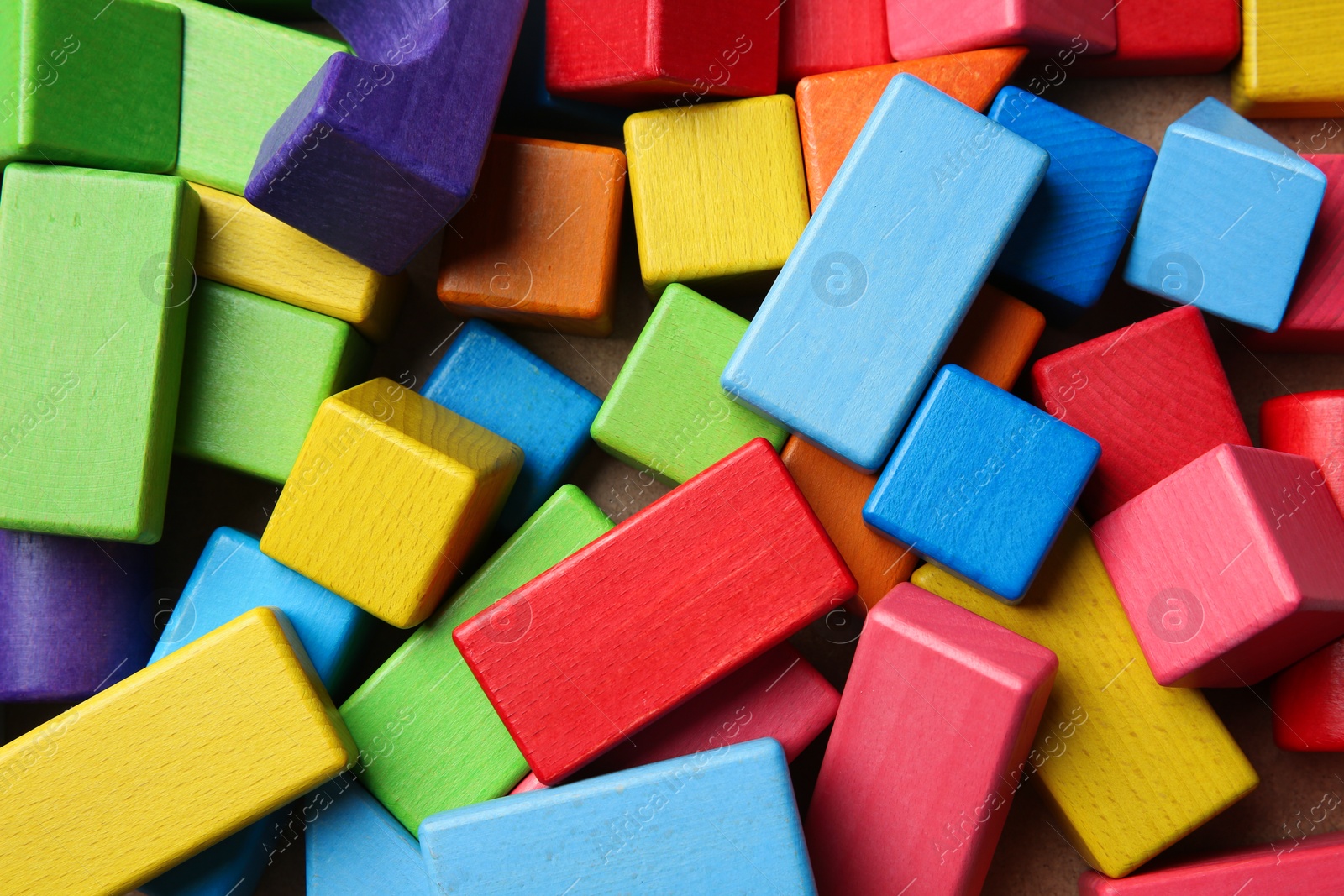 Photo of Wooden construction set as background, top view