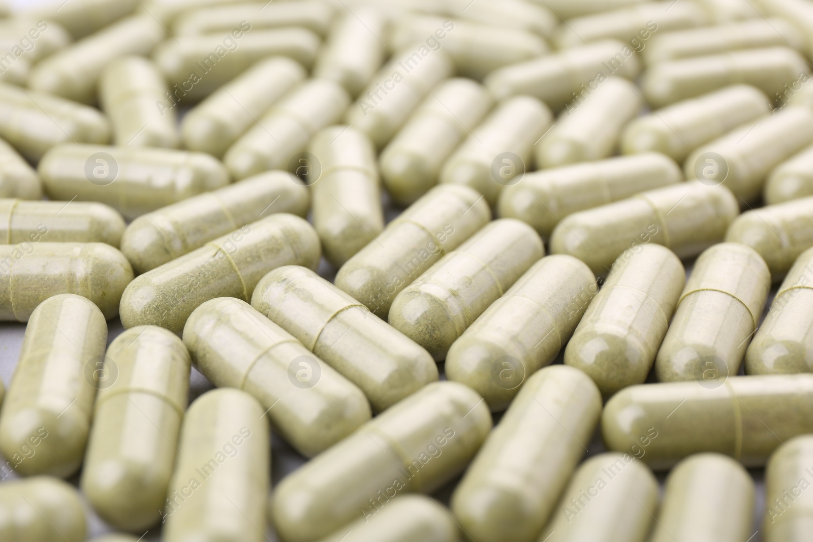 Photo of Many vitamin capsules as background, closeup view