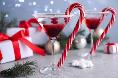 Photo of Delicious Christmas cocktail with liqueur on grey table