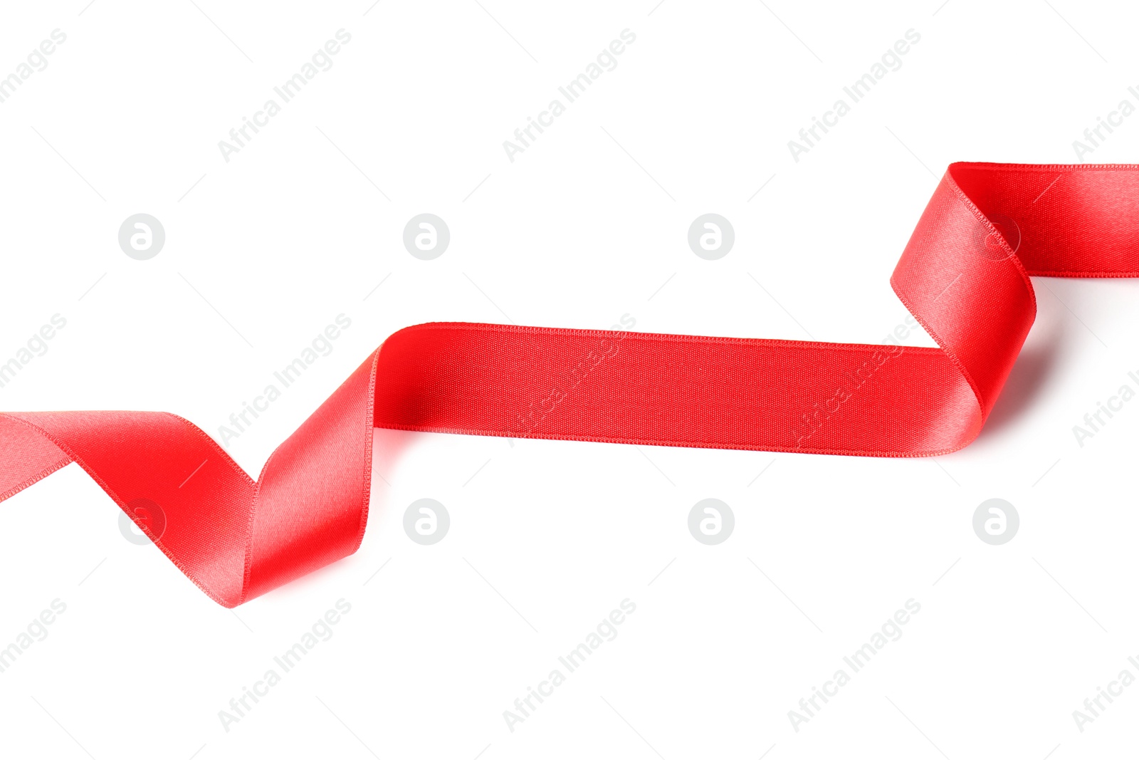 Photo of Simple red ribbon on white background, top view. Festive decoration