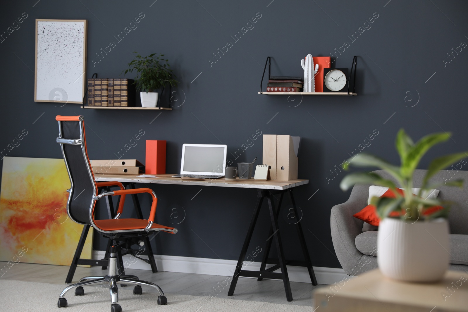 Photo of Modern workplace with comfortable chair in stylish home office interior