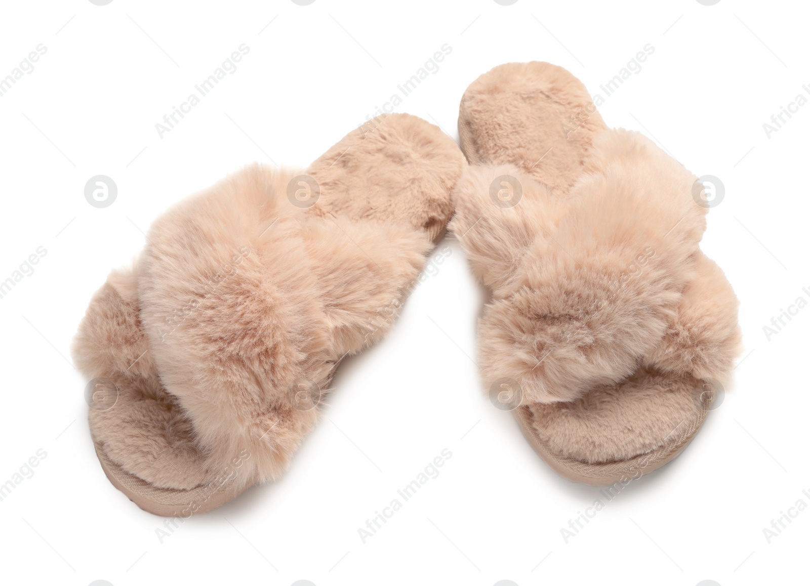 Photo of Pair of soft fluffy slippers on white background