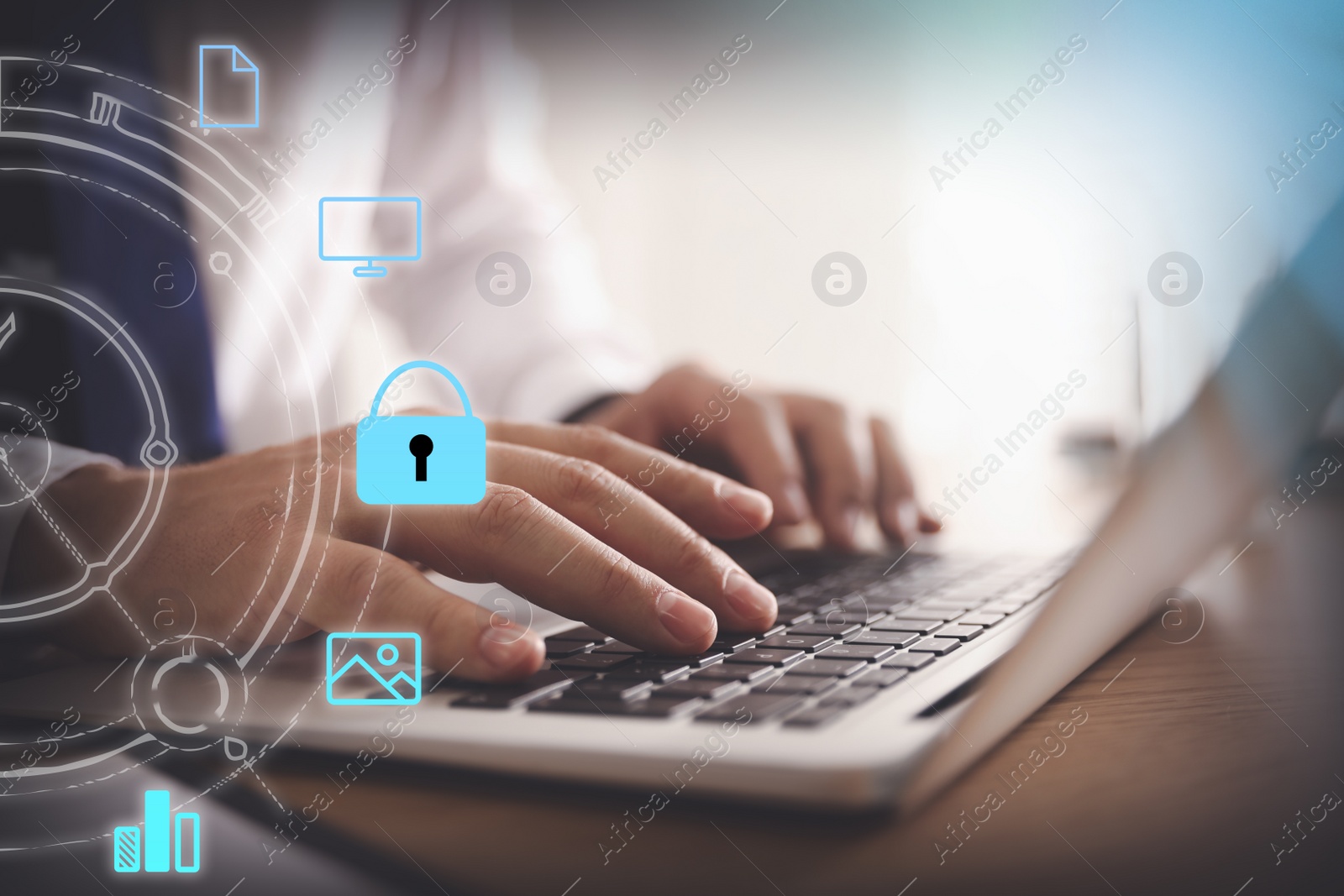 Image of Information security. Young man using laptop at table indoors, closeup