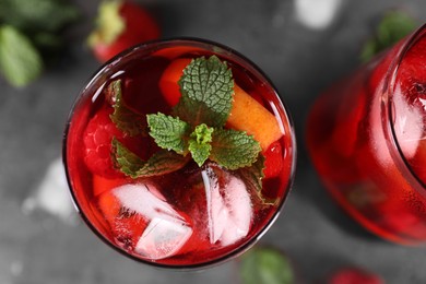 Glasses of delicious refreshing sangria on table, top view