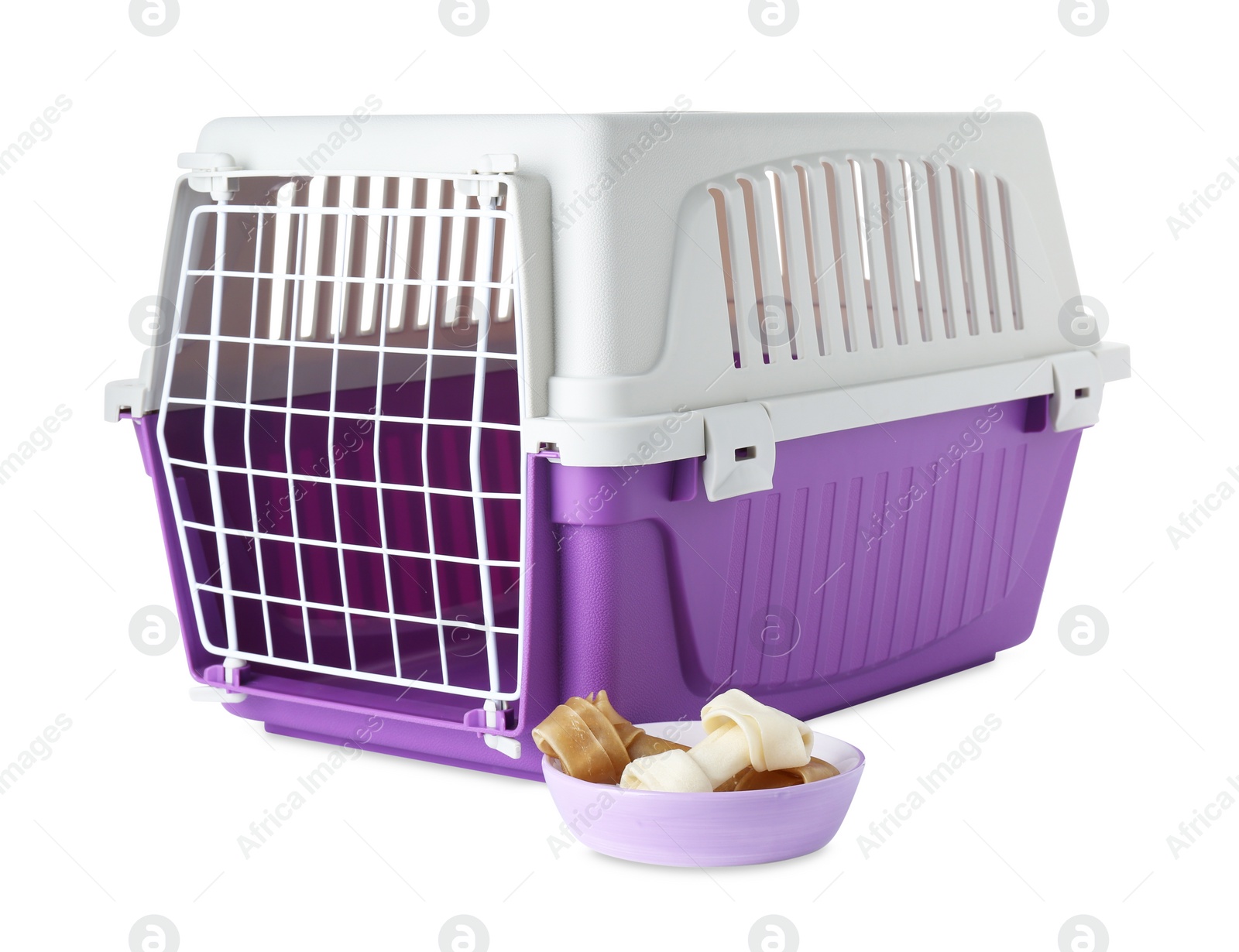 Photo of Violet pet carrier and bowl with chewing bones isolated on white