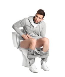 Photo of Man suffering from diarrhea on toilet bowl, white background