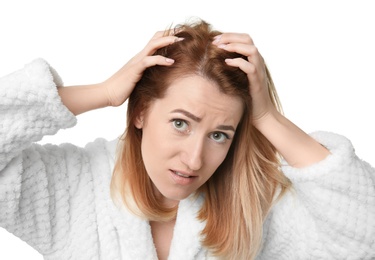 Young woman with hair loss problem on white background