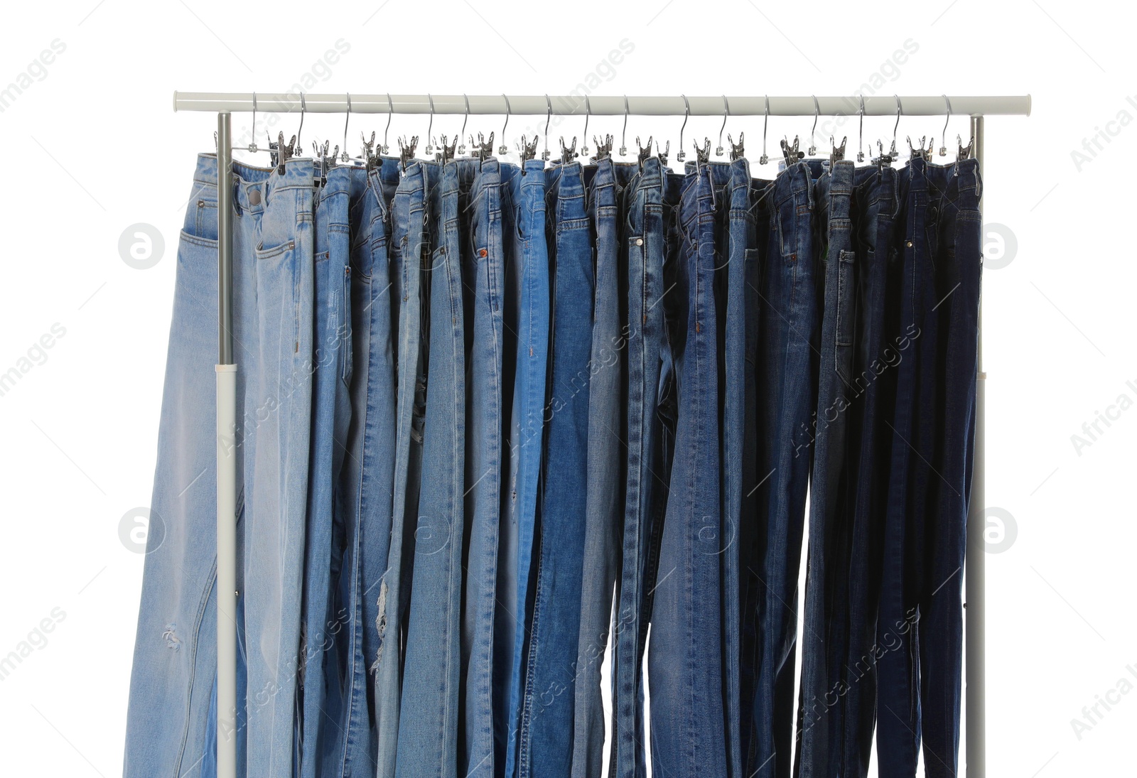 Photo of Rack with different jeans isolated on white