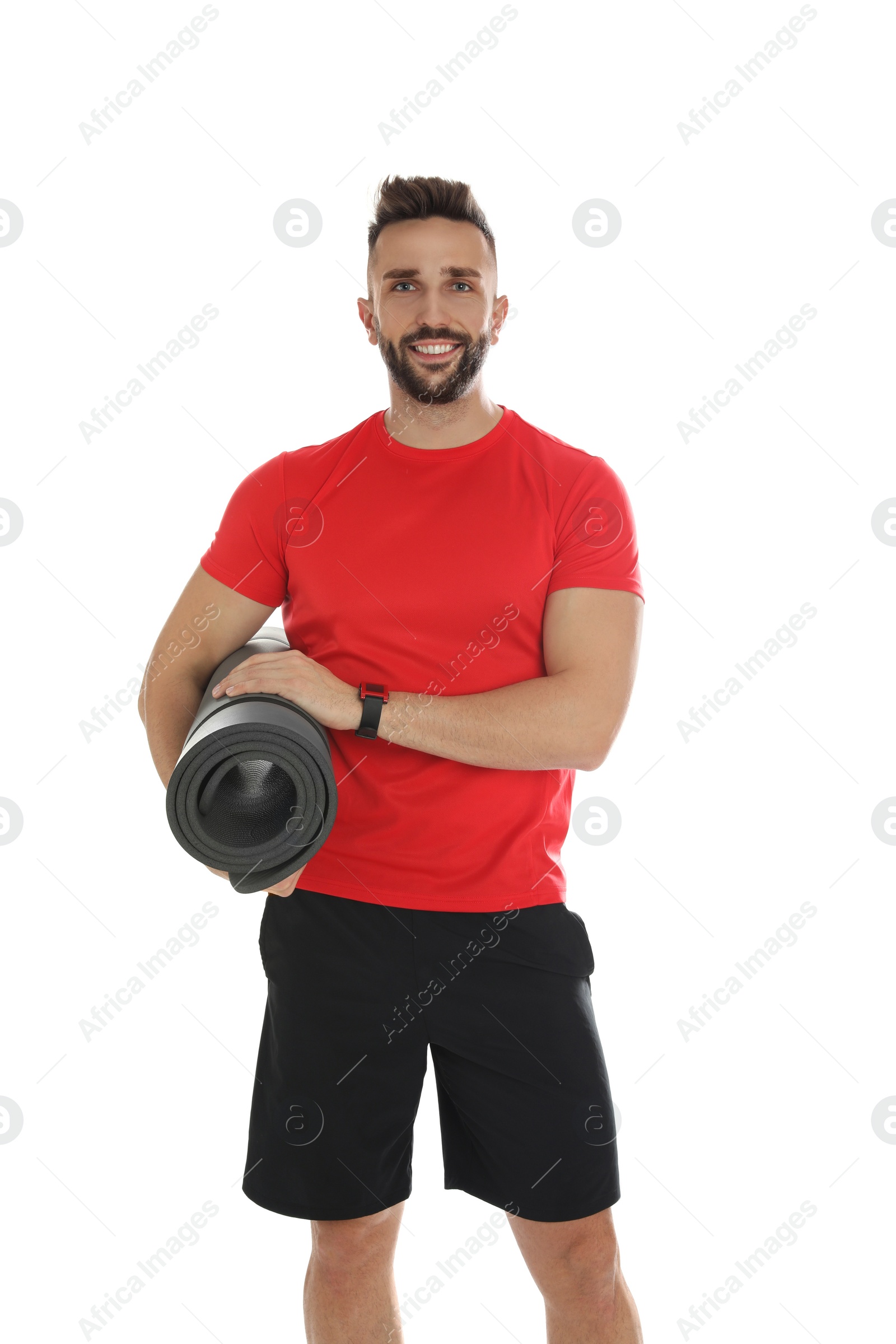 Photo of Handsome man with yoga mat on white background