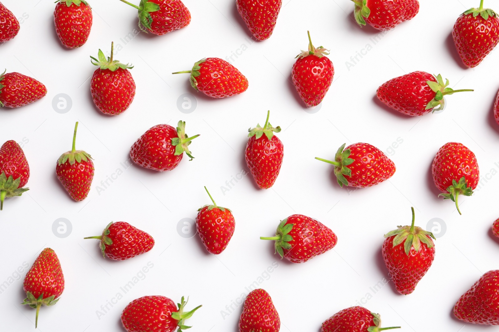 Photo of Flat lay composition with strawberries on light background