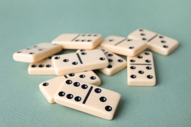 Photo of Pile of domino tiles on grey background