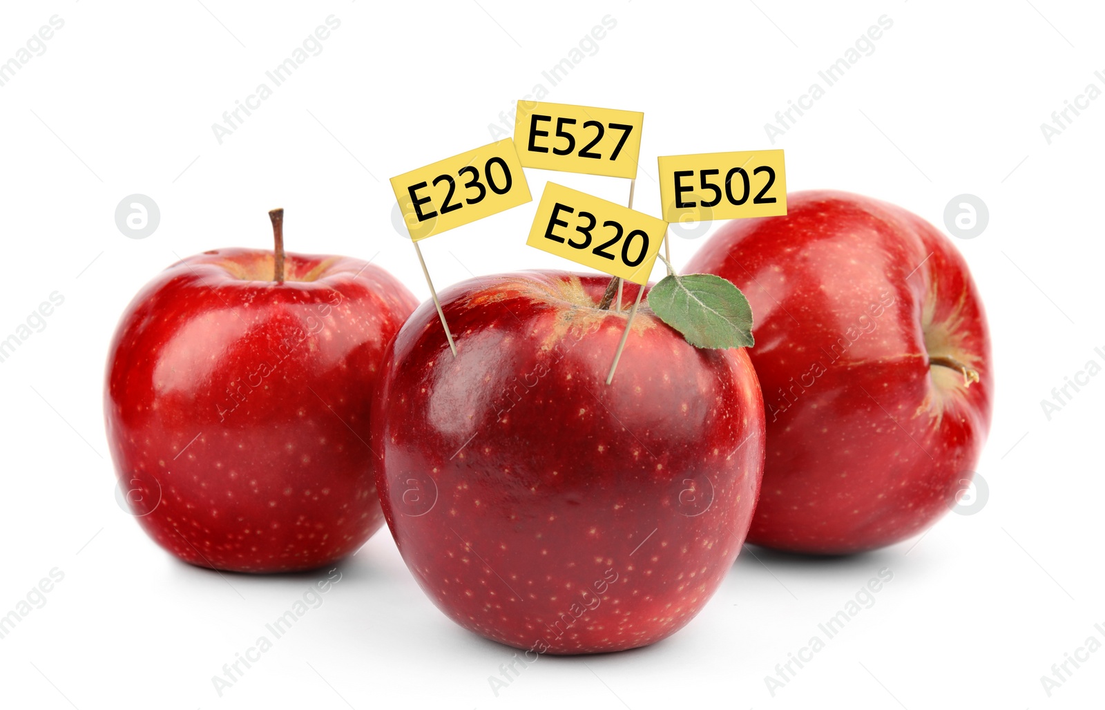 Image of Fresh apples with E numbers on white background. Harmful food additives 