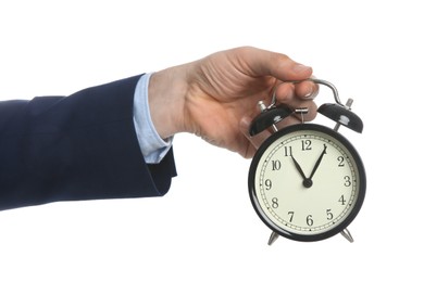 Photo of Businessman holding alarm clock on white background, closeup. Time management