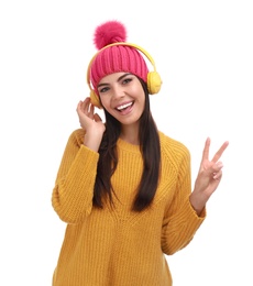 Photo of Young woman listening to music with headphones on white background