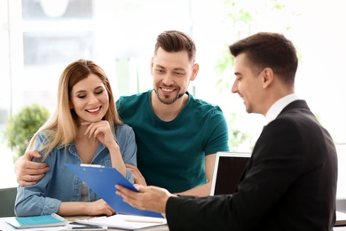 Young couple meeting with consultant in office