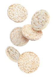 Puffed corn cakes falling on white background