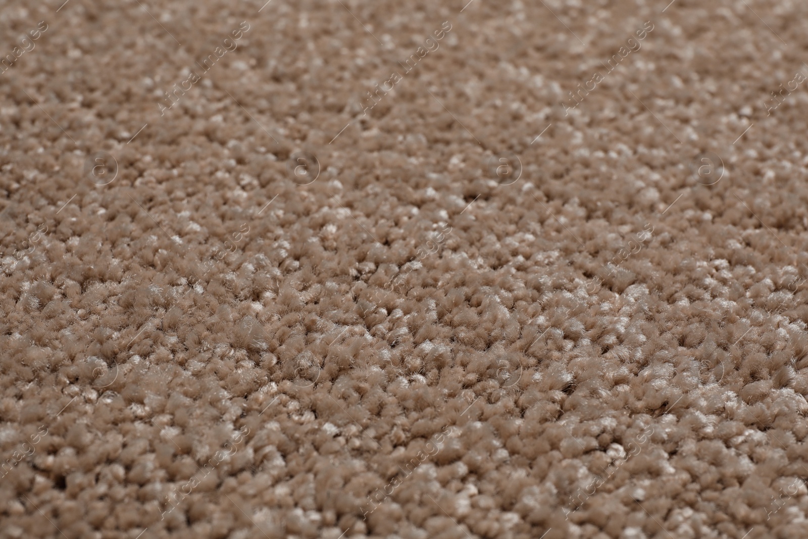 Photo of Fuzzy carpet texture as background, closeup view