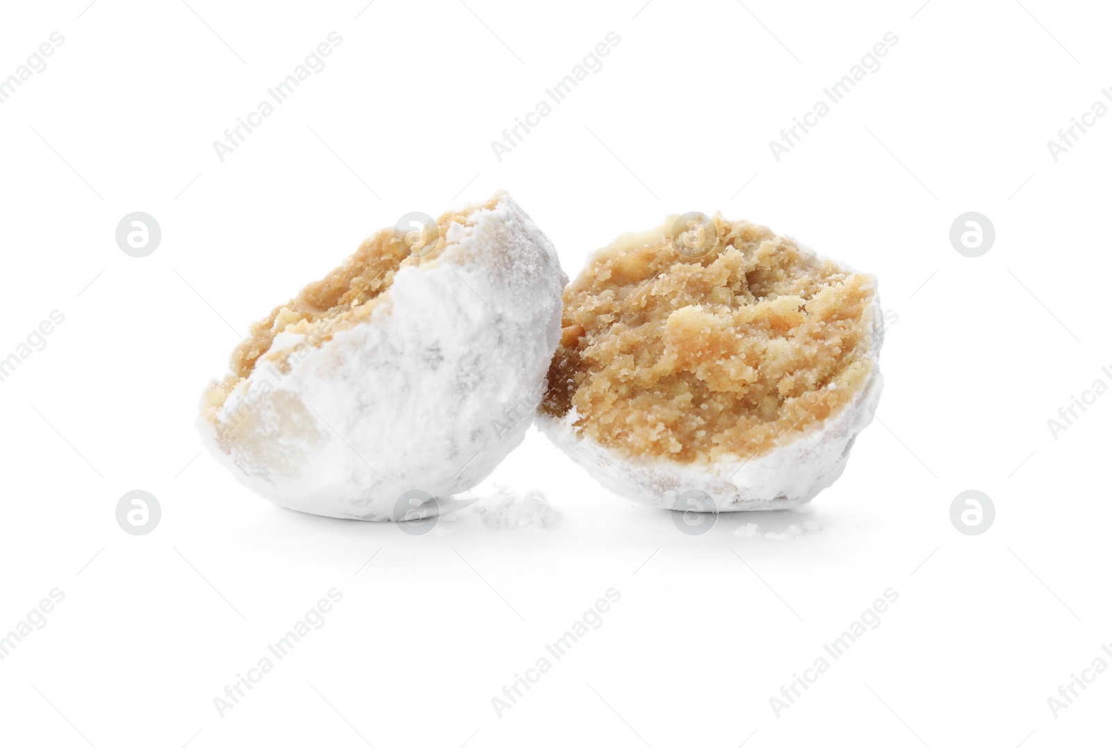 Photo of Halved Christmas snowball cookie on white background