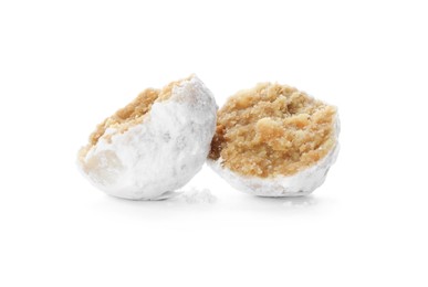 Halved Christmas snowball cookie on white background