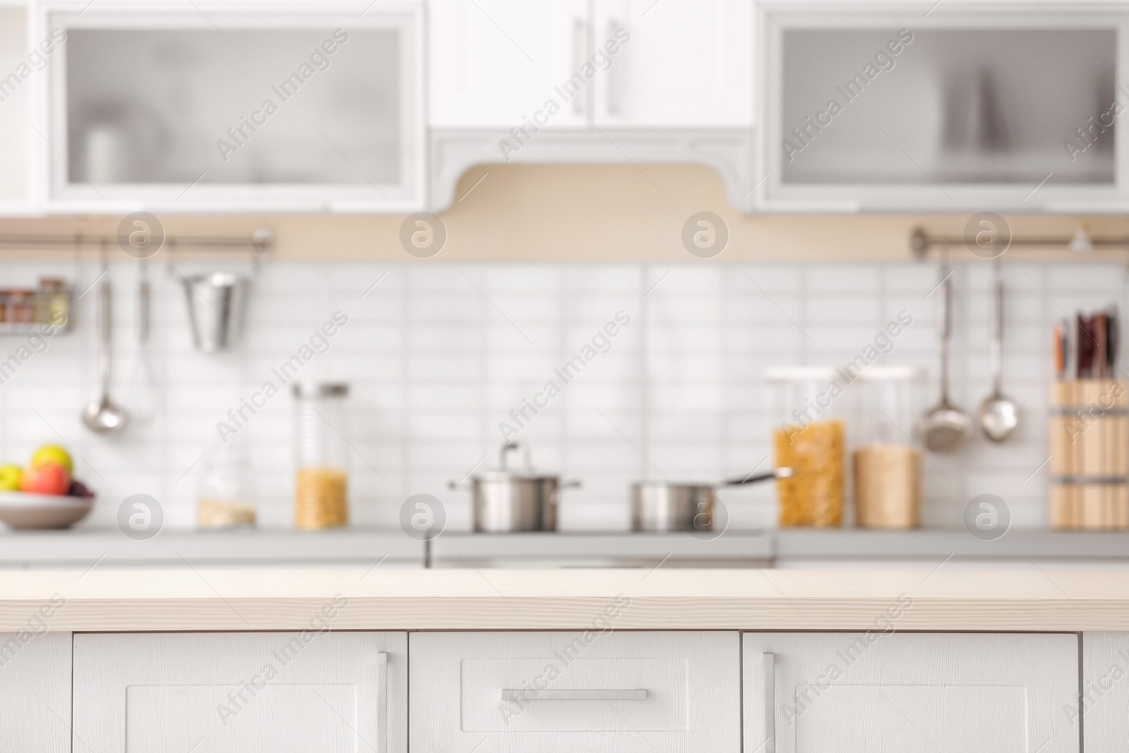 Photo of Countertop and blurred view of kitchen interior on background