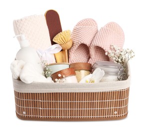 Photo of Spa gift set in wicker basket on table against white background
