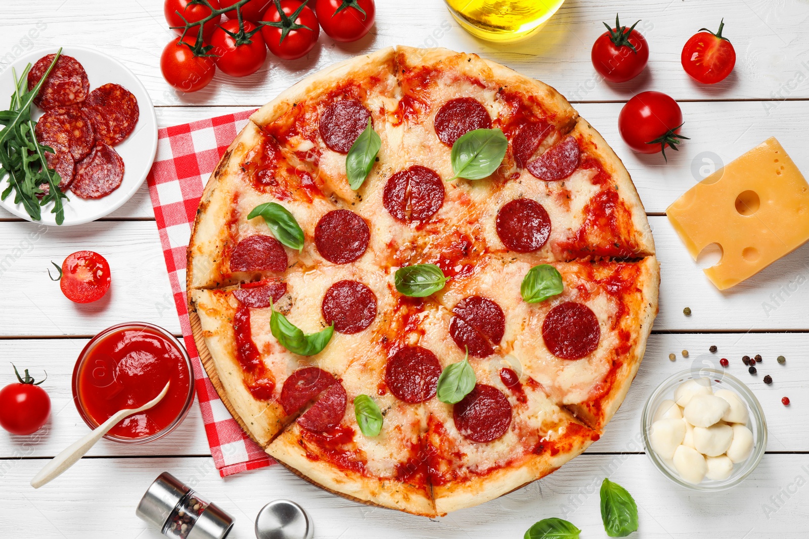 Photo of Flat lay composition with hot pepperoni pizza on white wooden table