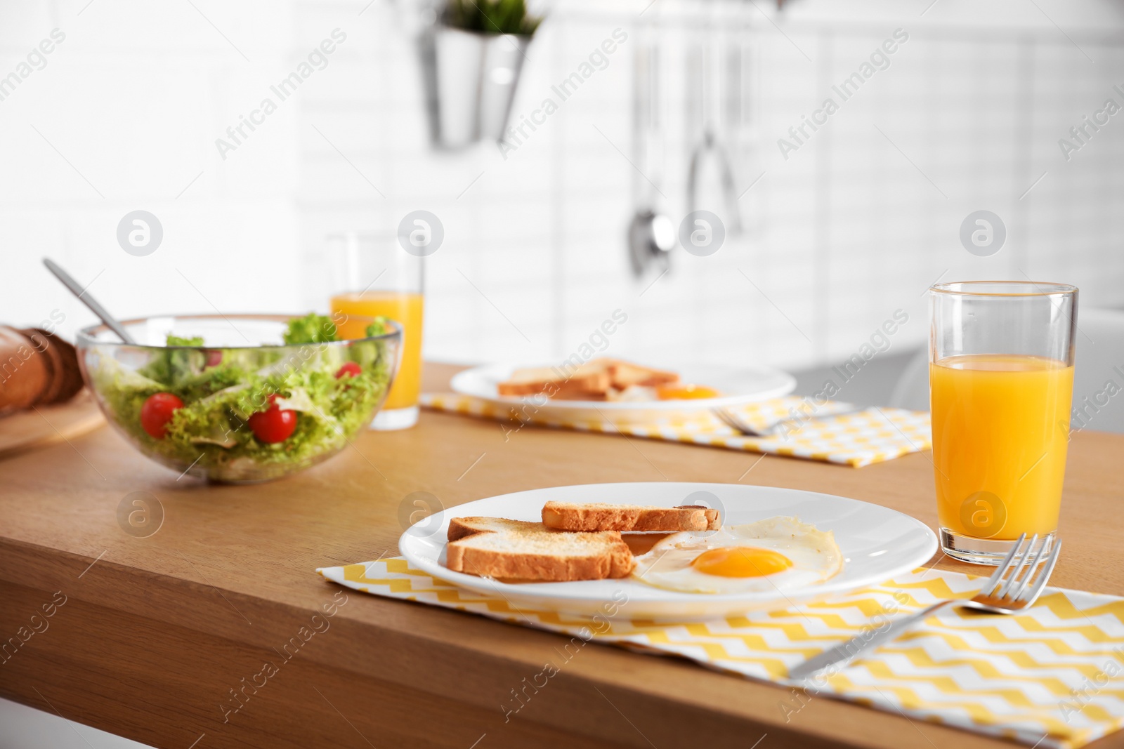 Photo of Tasty breakfast served on table in kitchen