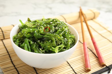 Japanese seaweed salad served on table, closeup