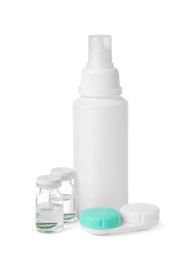 Photo of Color contact lenses and bottles of solution isolated on white