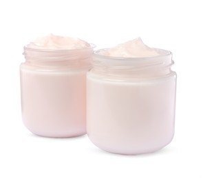 Jars of face cream isolated on white