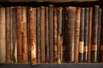 Collection of different library books on shelf, closeup