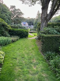 Photo of Netherlands, Amsterdam - July 19, 2022: Luxury hotel Het Roode Koper in beautiful green forest