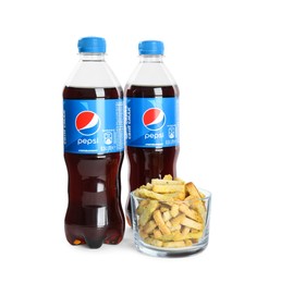 MYKOLAIV, UKRAINE - FEBRUARY 15, 2021: Plastic bottles of Pepsi and snack on white background