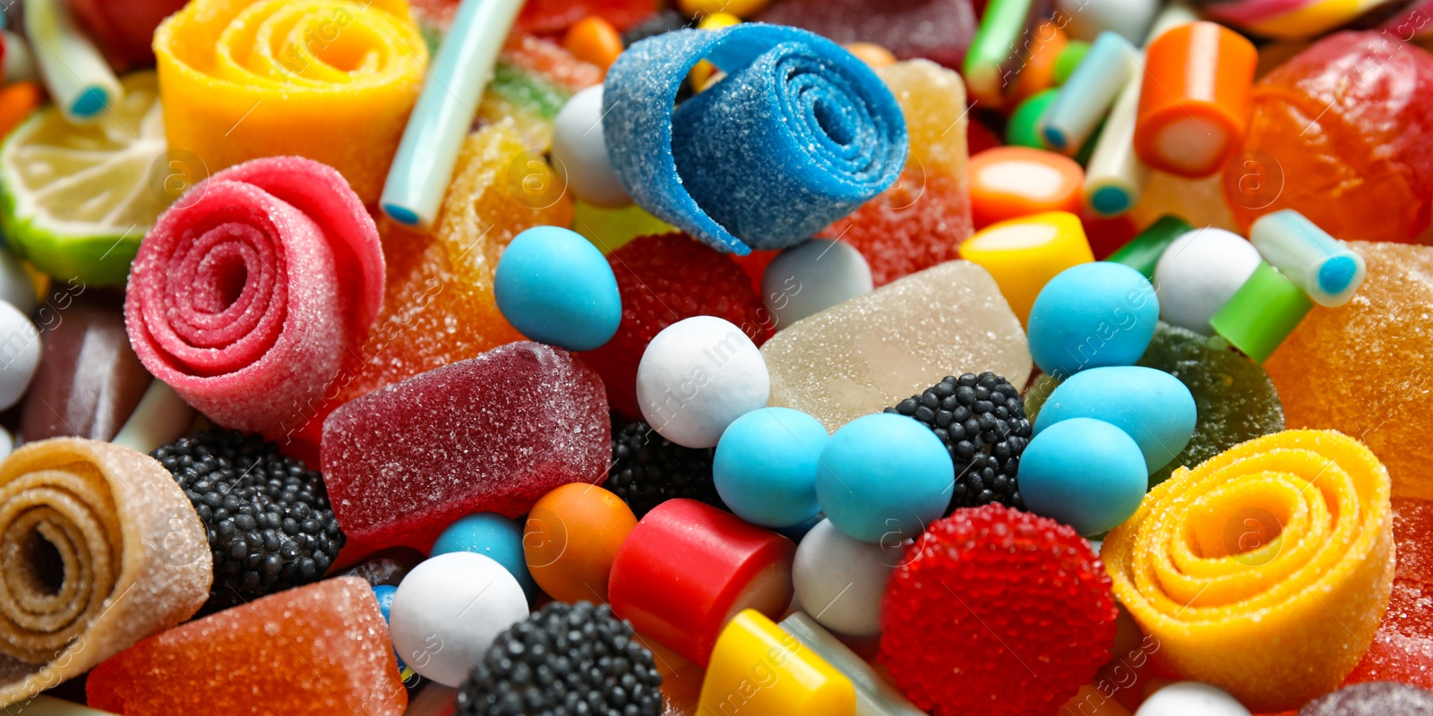 Image of Many different yummy candies as background. Banner design 