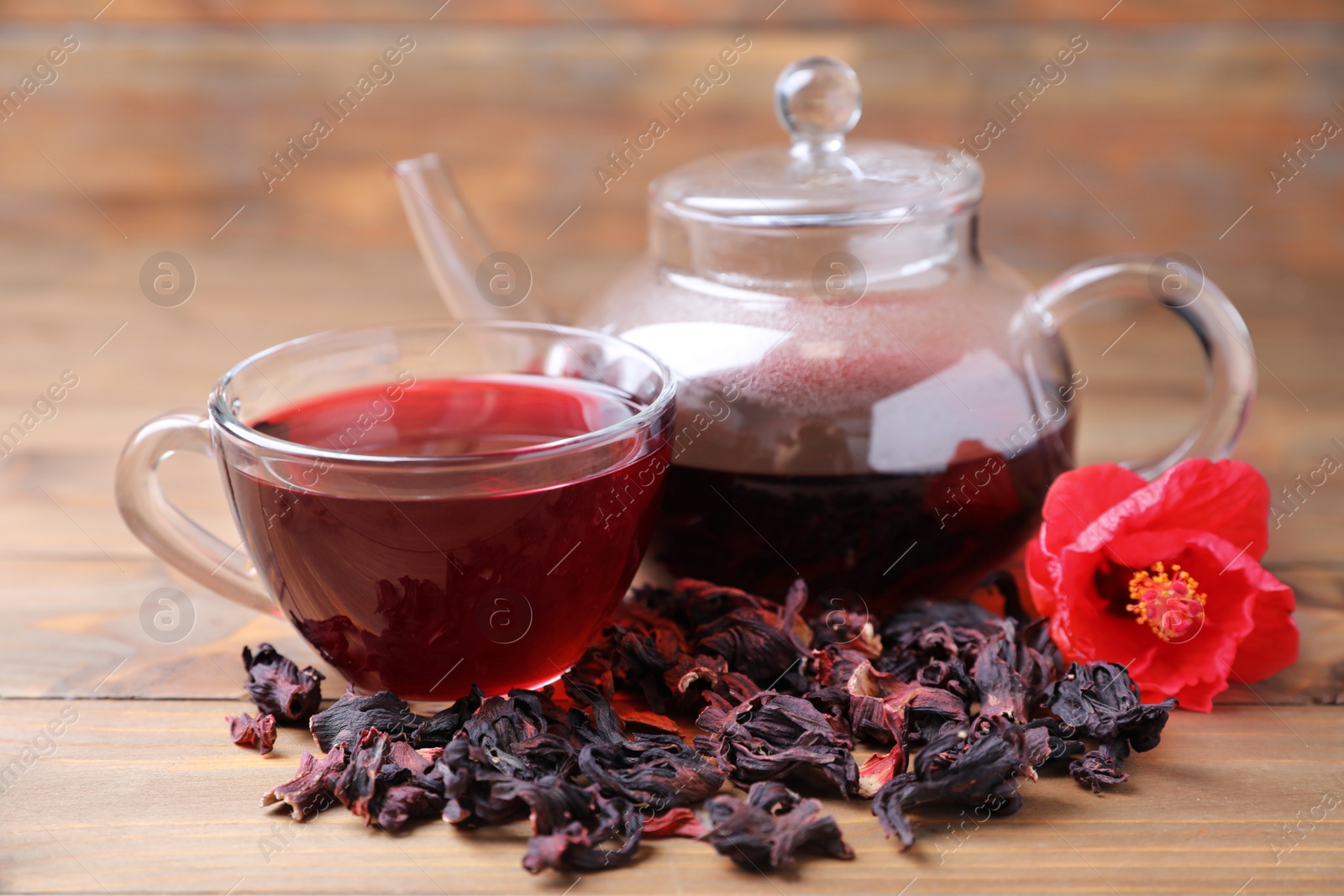 Photo of Composition with delicious hibiscus tea on wooden table