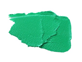 Photo of Green paint sample on white background, top view