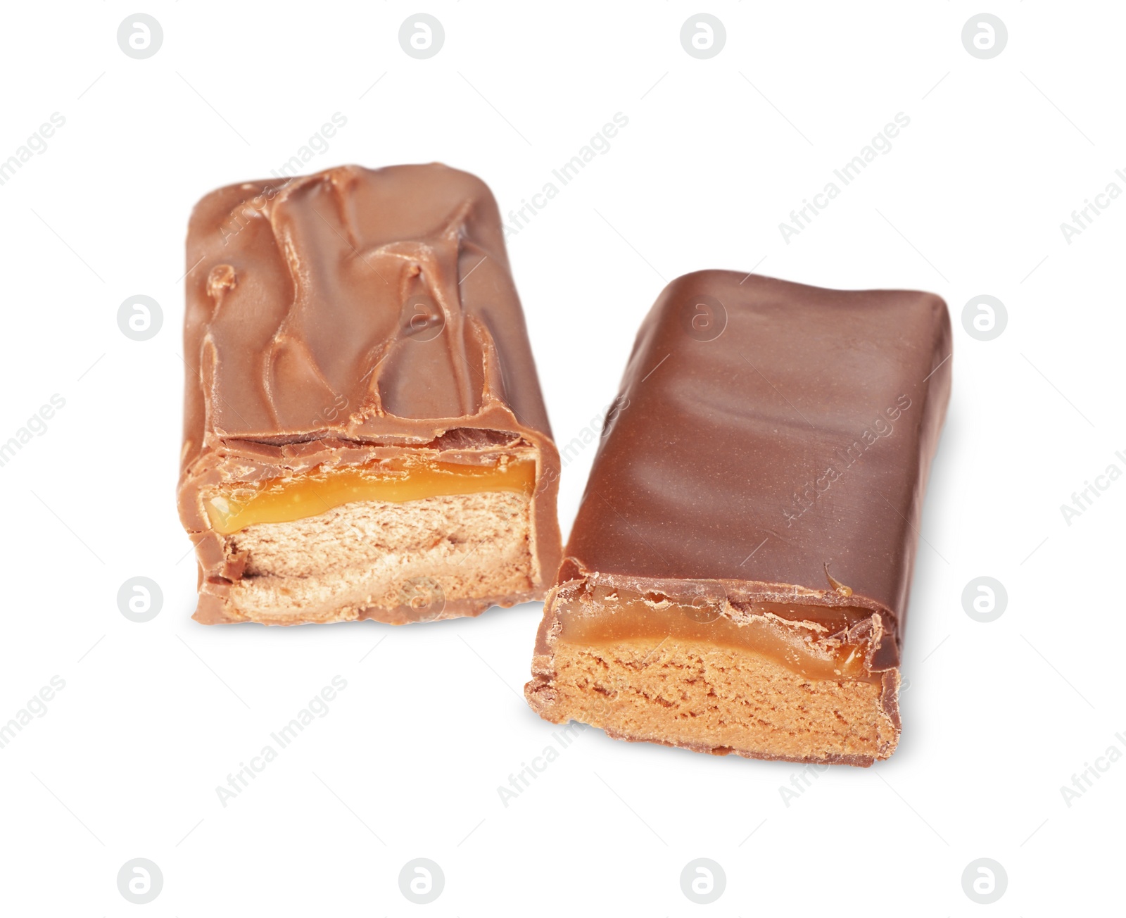 Photo of Pieces of tasty chocolate bars with nougat on white background